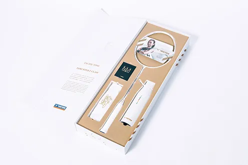 The gift box items: Tai’s first autograph racket, ...