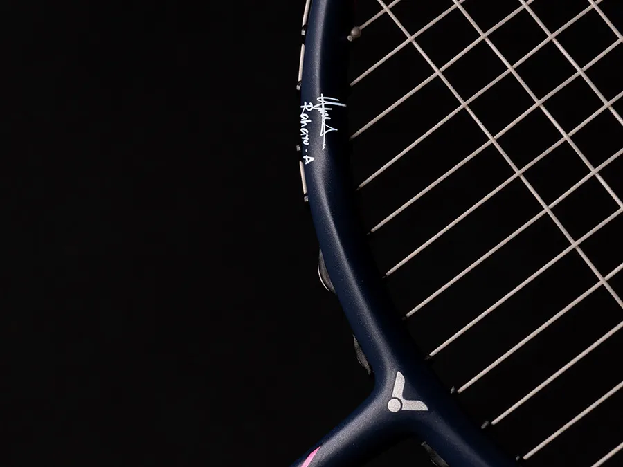 The racket frame is printed with Rahayu’s signatur...